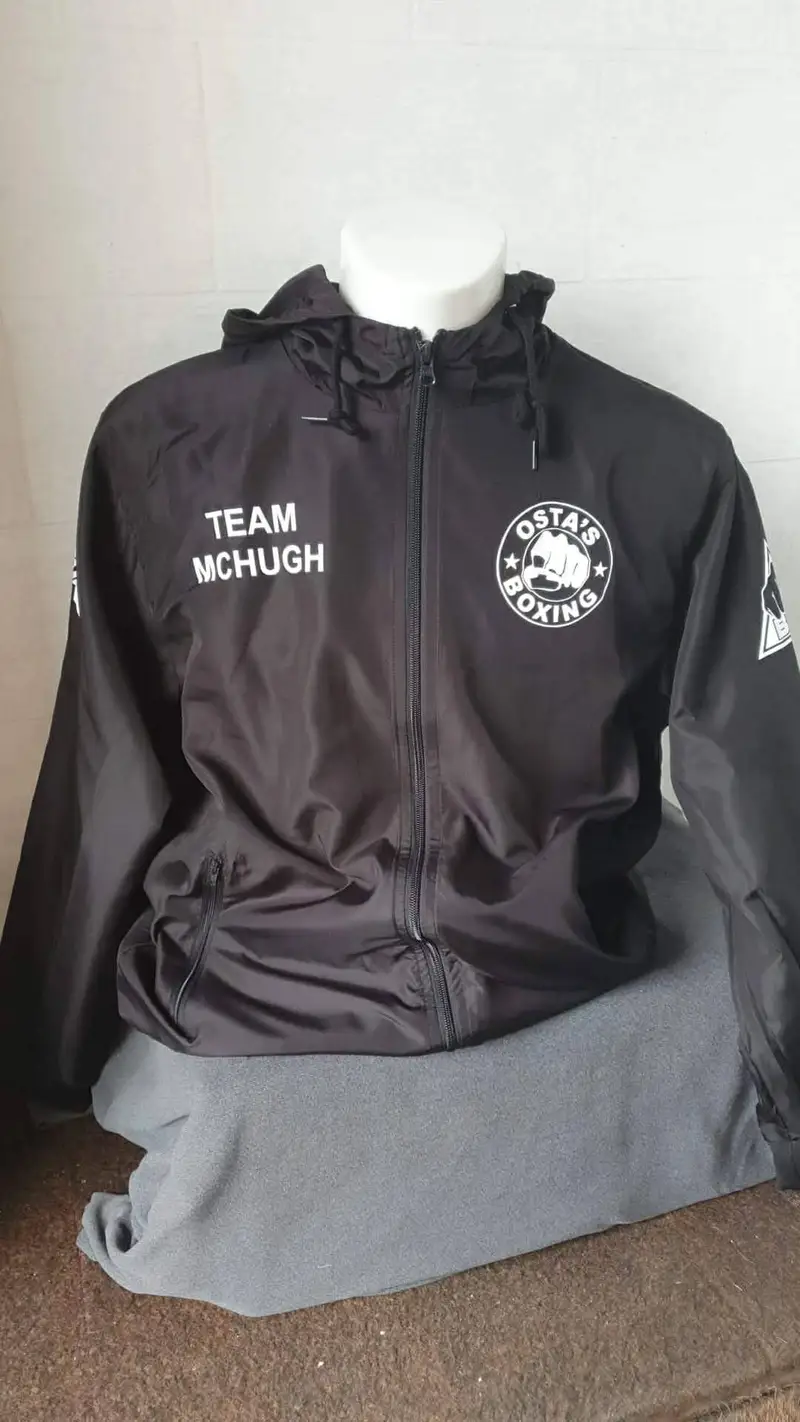 Black boxing team jacket printed with Team McHugh and the Ostas Boxing club badge