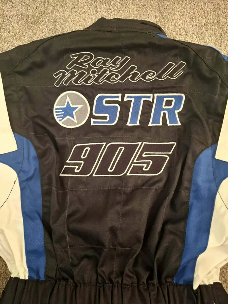 Motorsport race suit with Ray Mitchell, the STR roundel and race number 905 embroidered across the back